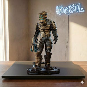 May include: A detailed figurine of a character in a futuristic armored suit, with a helmet and weapon. The figure is primarily bronze and black, standing on a black base. The neon sign in the background reads "kingSTL".