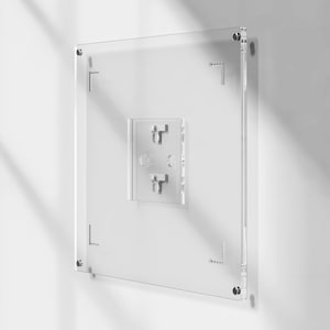 May include: A clear acrylic wall-mounted display case with a square shape. The case has a smaller, rectangular section in the center with two metal hooks. Metal hardware is visible at each corner and along the sides for mounting. The display case is mounted on a white wall.