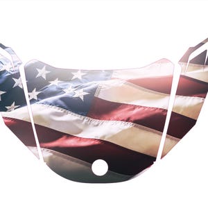 May include: A graphic of the American flag, featuring red and white stripes and a blue field with white stars. The design is shaped to fit a specific object, with a central circular opening.