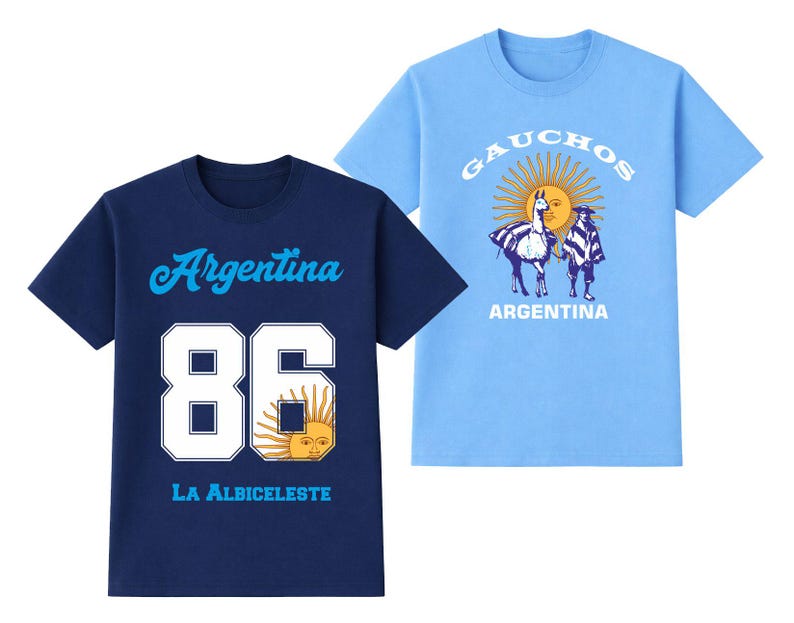 May include: Two short-sleeved t-shirts. One is navy blue with "Argentina" and "86" in white, plus a sun graphic. The other is light blue with "GAUCHOS" and a sun graphic, with two figures and a llama. "ARGENTINA" is printed below.