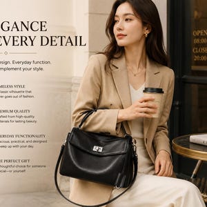 Professional woman carrying a black leather work tote while sitting at a cafe, genuine cowhide shoulder handbag for office, commuting, travel and everyday elegant style