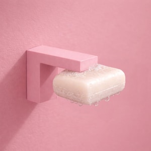 Könnte beinhalten: Ein Set aus drei Keramikbechern mit gesprenkelter, matter Oberfläche. Die Becher sind in Creme-, Hellgrau- und Dunkelgrautönen gehalten. Jeder Becher hat ein schlichtes, minimalistisches Design, perfekt für Kaffee oder Tee.