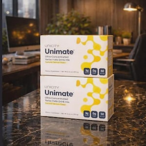 May include: Two boxes of Unicity Unimate Yerba Mate Drink mix. The boxes are white with yellow abstract designs and the Unicity logo. Each box has nutritional information, including 3g of protein, 0g of sugar, and 50 servings.