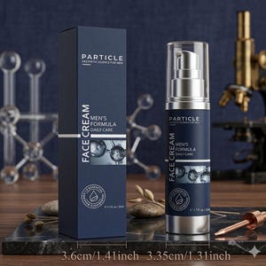 May include: A navy blue box and bottle of Particle Men's Formula Face Cream. The box and bottle have white text and silver accents. The box is 1.41 inches wide, and the bottle is 1.31 inches wide. The product is for daily care.