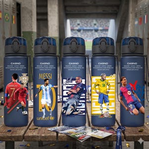 May include: Five navy blue water bottles with black lids, each featuring a different soccer player graphic. The bottles have the word "CASNO" and the text "HEALTHY-SAFELY-GREEN OUTSTANDING.COME FROM THE WATER LIFE STYLE". The players include Ronaldo, Messi, Kylian Mbappe, Neymar, and another player.