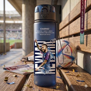 May include: A navy blue water bottle featuring a graphic of Neymar da Silva Santos Junior. The bottle has a black cap and a white and blue design. Text on the bottle reads "CASNO" and "HEALTHY SAFELY GREEN OUTSTANDING COME FROM THE WATER LIFE STYLE."