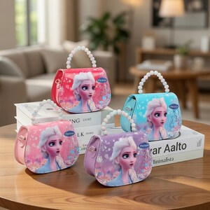 May include: Four colorful purses with pearl-like handles. Each purse features a portrait of a character from the movie "Frozen" and the word "Frozen". The purses are in shades of pink, red, blue, and purple, and are sitting on a wooden table.