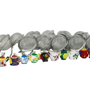 May include: A set of 12 tea infusers shaped like teapots. The tea infusers are made of stainless steel and have a mesh design. The teapots are painted in various colors and patterns, including red, blue, yellow, green, and white.
