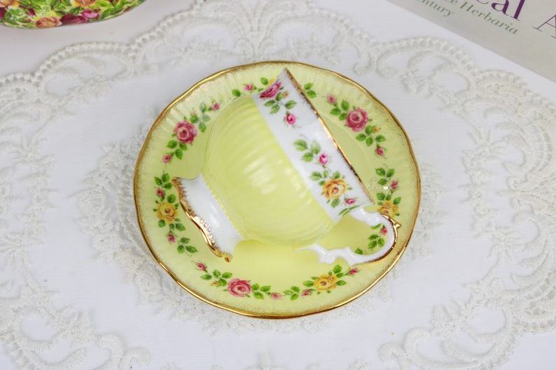 Elizabethan Pale Yellow Teacup and Saucer With Band of Roses, English