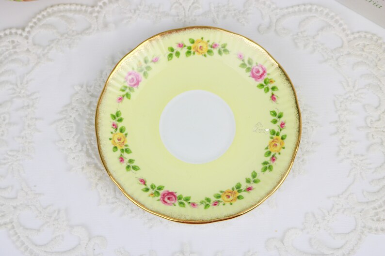 Elizabethan Pale Yellow Teacup and Saucer With Band of Roses, English