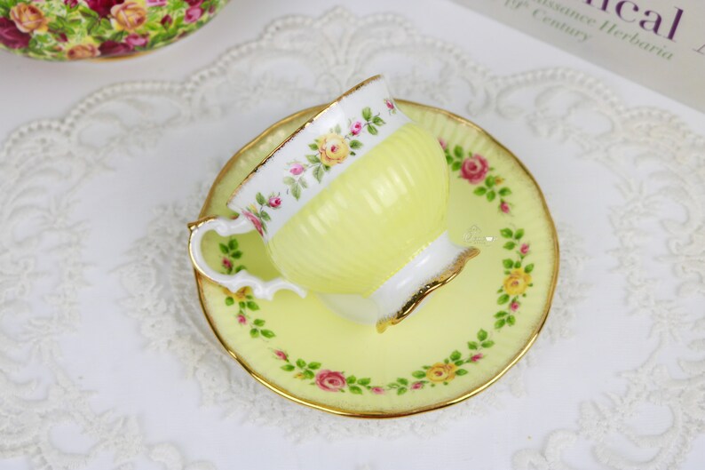 Elizabethan Pale Yellow Teacup and Saucer With Band of Roses, English