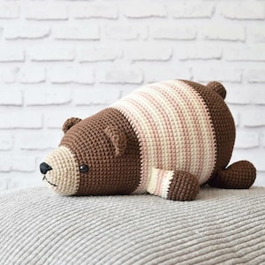 May include: A set of three ceramic mugs with a speckled, matte finish. The mugs are in shades of cream, light gray, and dark gray. Each mug has a simple, minimalist design and a rounded handle.