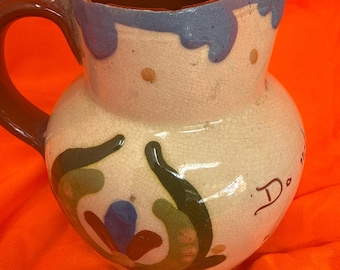 Vintage Torbay ware cream jug with motto