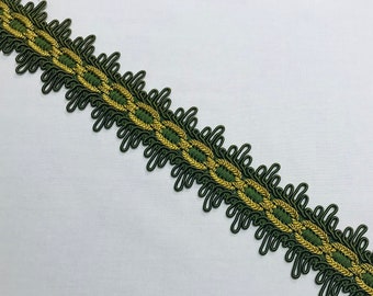May include: Green and gold trim with a scalloped edge. The trim has a woven design with a repeating pattern.
