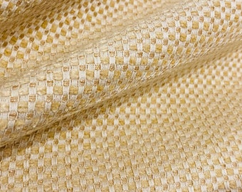 May include: Close-up of a woven fabric with a subtle checkered pattern in shades of beige and cream.