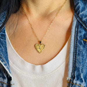 Sunburst-hart met kristallen vergulde ketting
