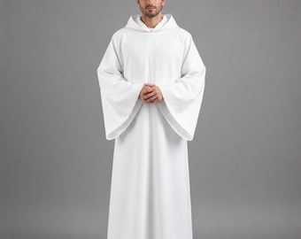 May include: A white hooded robe with wide sleeves. The robe is long, reaching the ankles, and is made of a smooth fabric. The person is wearing black shoes. The background is a solid gray.