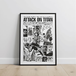 May include: Black and white framed poster featuring manga panels from "Attack on Titan." The title is prominently displayed in bold letters. The artwork depicts action scenes with characters and text in Japanese.