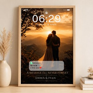 May include: A framed vertical print featuring a digital phone lock screen interface with the time 06:29 and date Sunday 12 April. The background shows a couple embracing at sunset over mountains. A message notification reads Biser I love you.