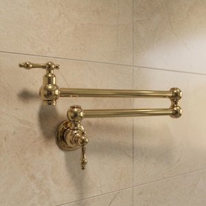 May include: A wall-mounted pot filler faucet with a polished gold finish. This articulated fixture features two long, horizontal arms connected by rotating joints, a circular base plate, and a single lever handle for controlling water flow.