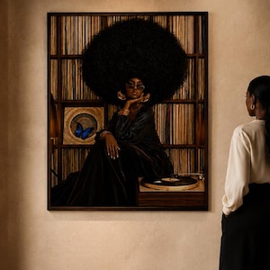May include: A large rectangular wall art print featuring a portrait of a person with a large afro hairstyle, wearing dark clothing and sunglasses, seated before a record shelf with a vibrant blue butterfly and a vinyl record player visible.