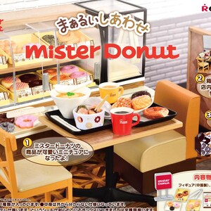 May include: Miniature Mister Donut diorama set featuring a display case filled with donuts, a table with food and drinks, and a small chair. The set includes a red coffee mug and various donut boxes.