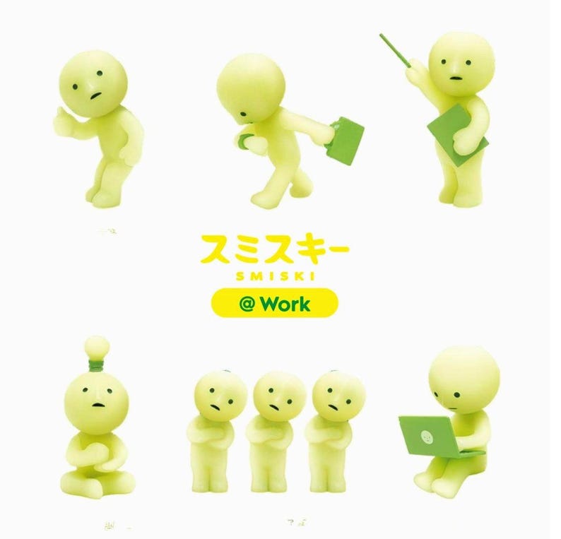 a collection of six small, yellow figurines depicting various poses and activities, including a person holding a book, a person with a laptop, and a person with a lightbulb.