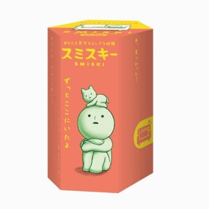 A box with a cartoon character on it, featuring a cat sitting on top of the character.
