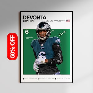 May include: A framed poster featuring Devonta Smith in an Eagles uniform. The poster includes the text "DEVONTA SMITH" and "6", along with the phrase "Precision beats power." The American flag is visible in the upper right corner. A "50% OFF" sticker is on the left.