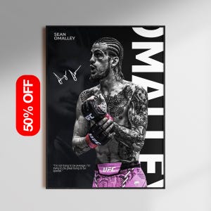 May include: A framed poster featuring Sean O'Malley in a black and white portrait. He is wearing black UFC gloves with pink wrist wraps and pink and purple shorts. The poster includes the text "SEAN O'MALLEY" and a quote. A red sticker indicates a 50% discount.