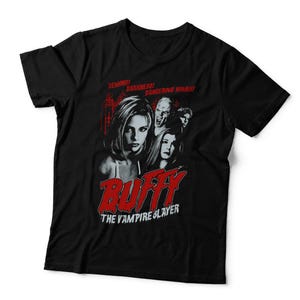 May include: A black short-sleeved t-shirt featuring a graphic print of characters from Buffy the Vampire Slayer. The design includes the red text "DEMONS! DARKNESS! DANGEROUS WOMEN!" above the cast and the red "BUFFY" logo with "THE VAMPIRE SLAYER" below.