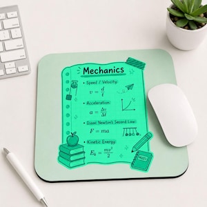 May include: A light green mousepad with the word "Mechanics" and physics formulas. The design includes a paper-like graphic with equations for speed, acceleration, and kinetic energy, plus a stack of books, an apple, and a pencil. A white mouse and keyboard are visible.