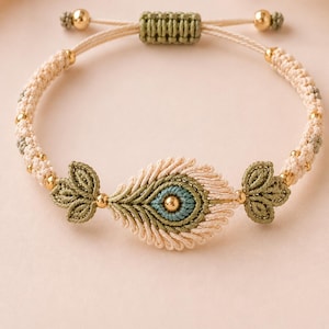 May include: A macrame bracelet featuring a central peacock feather motif in cream, sage green, and teal thread. The design includes small gold-toned metallic beads integrated into the woven band and a sliding knot closure with gold-toned end beads.