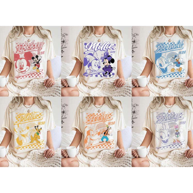 May include: Six cream-colored t-shirts featuring Disney characters. Each shirt has a different character design, including Mickey, Minnie, Donald, Pluto, Goofy, and Daisy. The designs are in various colors with a retro style.