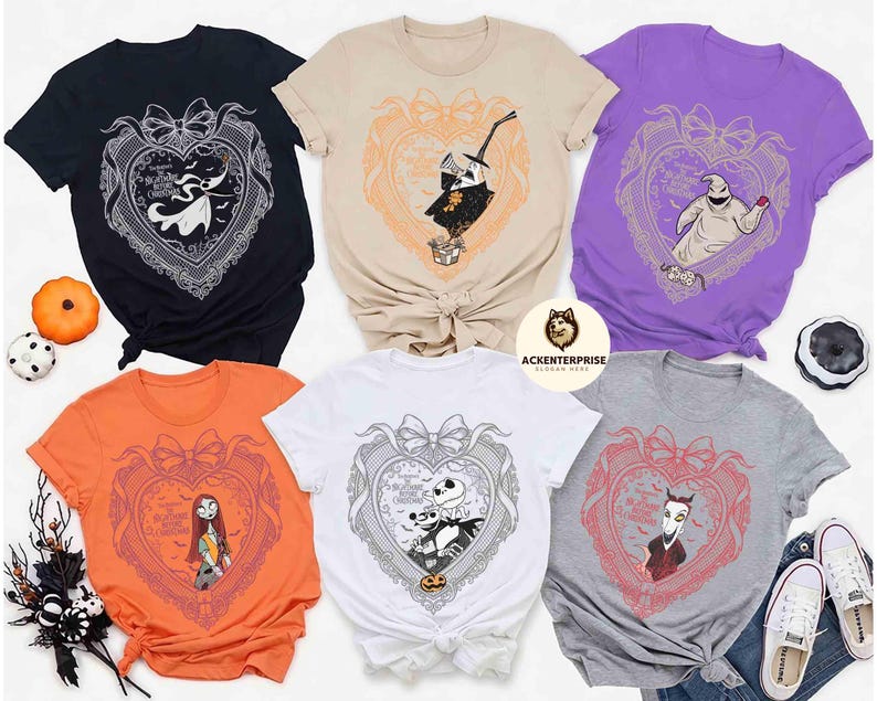 May include: Assorted-color t-shirts featuring characters from "The Nightmare Before Christmas." Each shirt displays a character within a heart-shaped frame with a bow. Colors include black, tan, purple, orange, white, and gray. The shirts are styled with a knot at the waist.