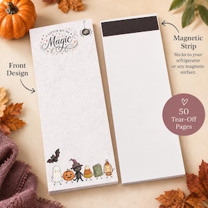 May include: A rectangular magnetic notepad with 50 tear-off pages. The top features the text A Little Bit of Magic and a spider illustration. The bottom displays a ghost, pumpkin, cat in a witch hat, candy corn, book, and lantern.