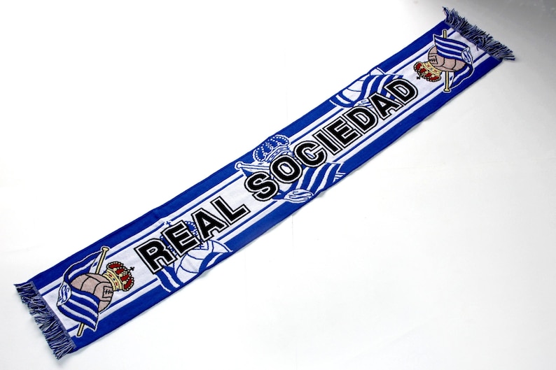 May include: A set of three ceramic mugs with a speckled, matte finish. The mugs are in shades of cream, light gray, and dark gray. Each mug has a simple, minimalist design, perfect for coffee or tea.