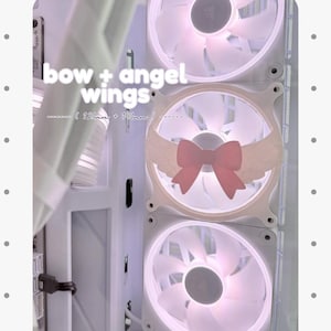 May include: A white computer cooling fan set featuring a pink bow and angel wings attachment on the centre hub. The text "bow + angel wings" and "( 120mm + 140mm )" is visible. The fans are illuminated with a soft white light within a white case.