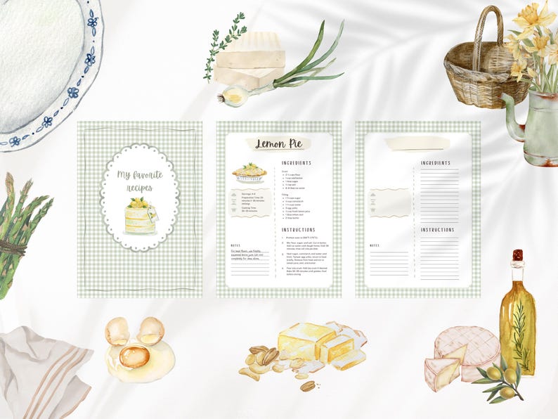 Peut inclure: Illustration &agrave; l'aquarelle d'un livre de recettes et de divers aliments. La couverture du livre de recettes indique "Mes recettes pr&eacute;f&eacute;r&eacute;es" et pr&eacute;sente un g&acirc;teau. Autres &eacute;l&eacute;ments : une assiette, des asperges, des &oelig;ufs, du fromage et une bouteille d'huile d'olive.