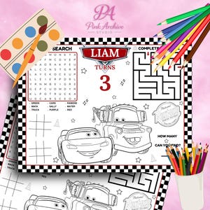 May include: A coloring placemat featuring characters from the movie Cars, with a maze, word search, and tic-tac-toe. The placemat is personalized with the name "Liam" and the number "3". Colored pencils and a watercolor palette are included.