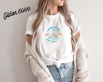 Sunshine and Surf Goose Shirt | Funny Beach Goose Tee | Summer Vacation Shirt | Coastal Goose Graphic Tee | Cute Surfing Bird Shirt.