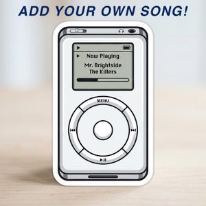 May include: White sticker of a classic digital music player with a screen displaying "Now Playing: Mr. Brightside, The Killers." The sticker has a menu button and control buttons. The text "ADD YOUR OWN SONG!" is at the top.
