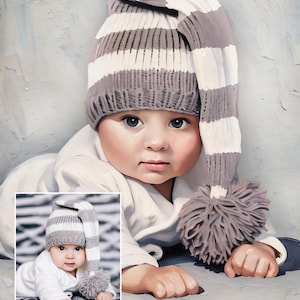 K&ouml;nnte beinhalten: Ein Baby tr&auml;gt eine lange, locker sitzende Strickm&uuml;tze mit horizontalen grauen und wei&szlig;en Streifen und einem gro&szlig;en grauen Bommel am Ende. Das Baby tr&auml;gt ein schlichtes wei&szlig;es Langarmshirt und liegt in einer ruhenden Position.