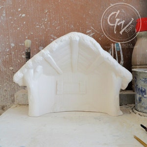May include: White ceramic nativity scene stable with a thatched roof and a single window. The stable is unpainted and ready to be decorated.