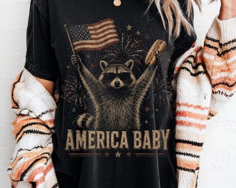 Raccoon Holding Flag Hot Dog T-Shirt | Retro Patriotic America Baby Tee