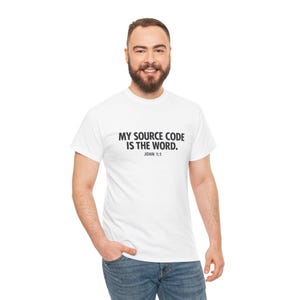 May include: White t-shirt with the text "MY SOURCE CODE IS THE WORD. JOHN 1:1" printed in black. The shirt is a classic crew neck style.