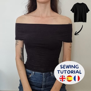 May include: A black off-the-shoulder top with short sleeves and a fitted silhouette. The image includes a small inset of a black t-shirt with an arrow pointing to the top, and a white circular graphic with the text SEWING TUTORIAL.
