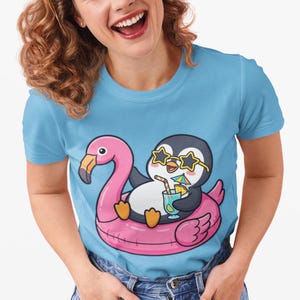 Penguin in Flamingo Float T-Shirt | Summer Pool Drink Cartoon