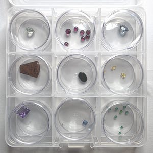Assorted Gemstone Collection: 9 Capsules of Mixed Natural, Lab-Grown, Simulant Stones (Collector Display Set) with Storage Case CW3053
