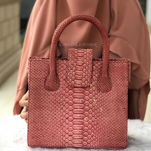 May include: A white ceramic mug with a black handle and the text "But First, Coffee" in a bold, black font. The mug is likely 325-440 ml in size, ideal for a morning beverage.